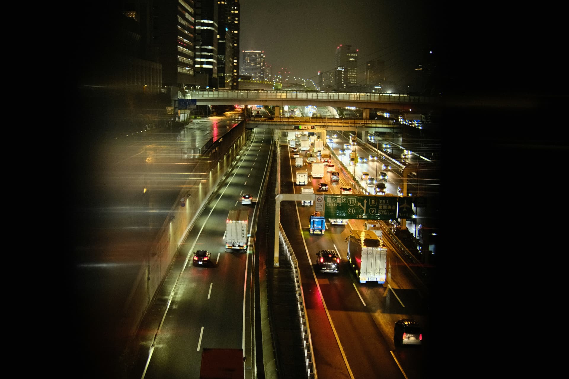 City highway glowing at night, seen from above