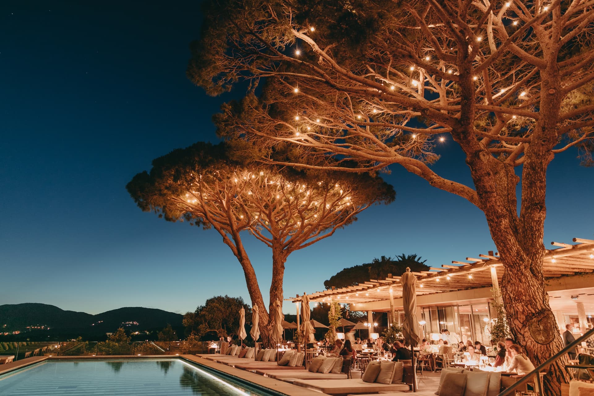 Champagne and oysters on a terrace at golden hour